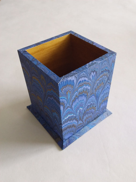 A pen pot decorated with the beautiful marble paper designs from Italian paper maker Il Papiro