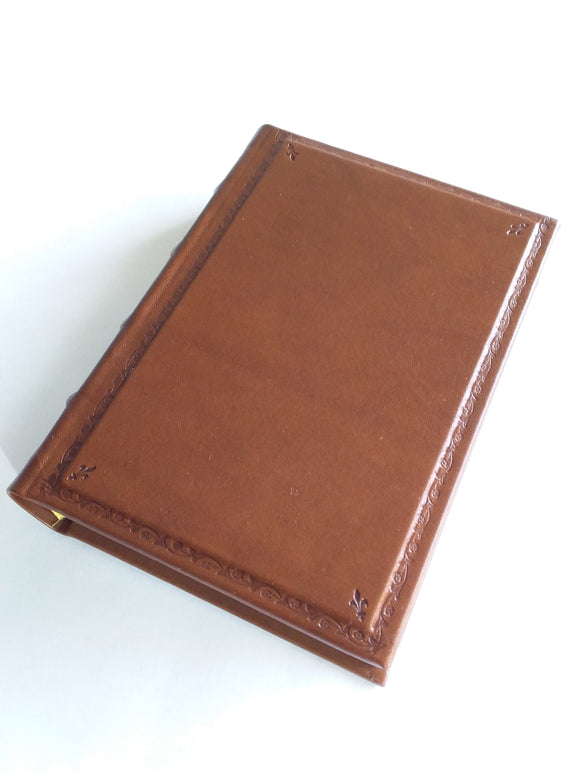 Handsome hardbound Italian tan leather journal with a generous page count and a beautiful hand-tooled border