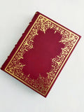 Burgundy Italian leather journal with hand tooled gold leaf cover and spine, marbled end paper