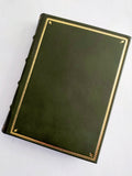 Green Italian leather journal with hand tooled gold leaf cover and spine, marbled end paper. Back of journal