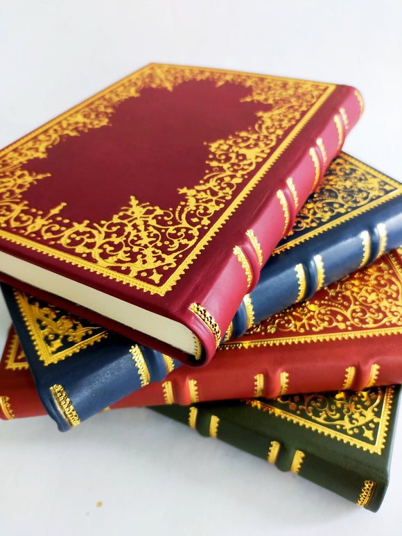 Italian leather journal with hand tooled gold leaf cover and spine, marbled end paper. assorted colours