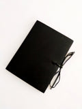 Black soft leather journal with ties, blank pages