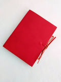 Red soft leather journal with ties, blank pages