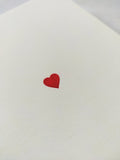 Folding card with hand embossed red heart