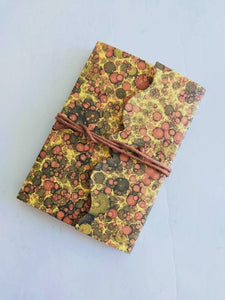 Small lined Notebook, soft cover with tie. Hand marbled