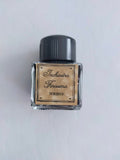 Black square ink bottle with ink