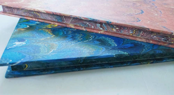 Guest book / marble paper with hand decorated edge. Lined pages inside