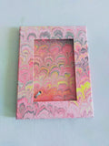 self standing pink and yellow marbled wooden picture frame peacock patter with screen