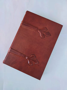 Italian leataher journal with ancient embossing on cover and marbled end papers