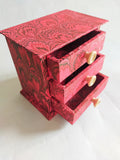 Red marbled desktop organizer with three drawers