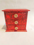 Red marbled desktop organizer with three drawers