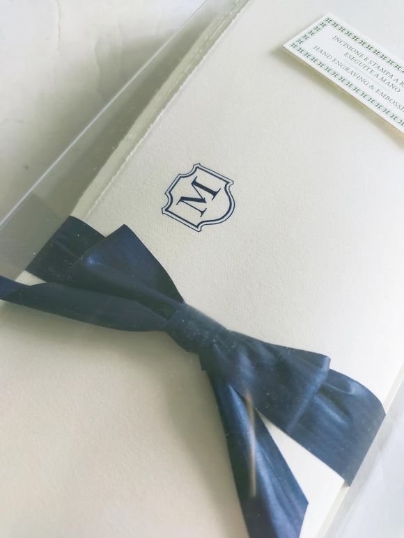 Set of Deckled edge stationery paper sheets with embossed blue monogram and envelope